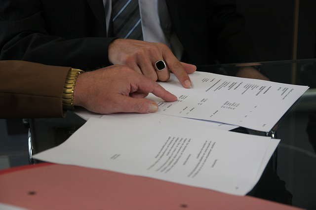 Two people reviewing a contract